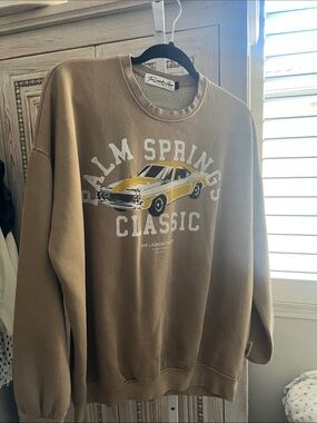 The Laundry Room Palm Springs Classic Tan Sweatshirt with Yellow Car Graphic